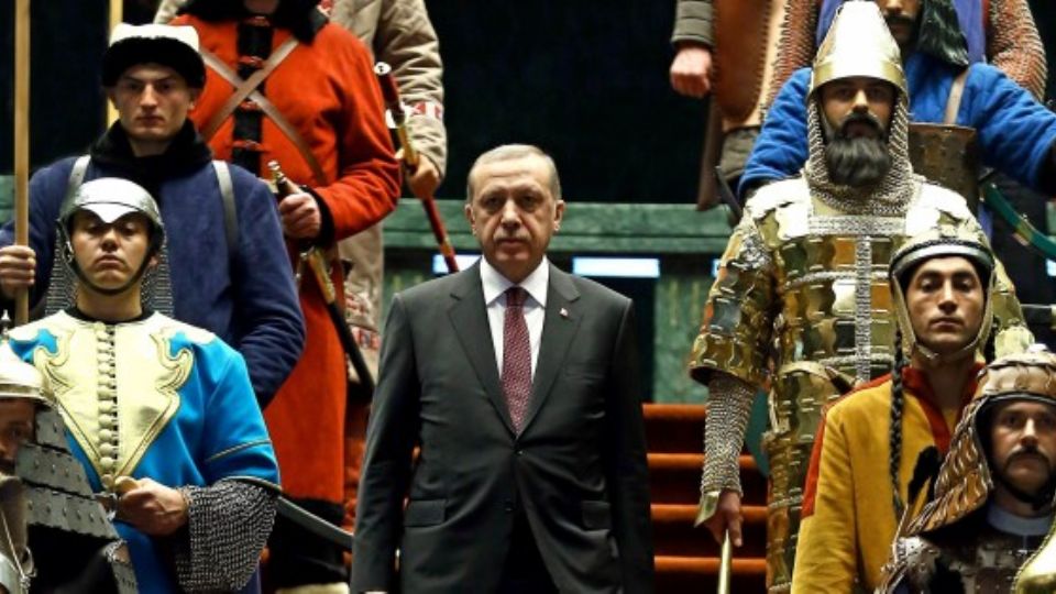 ANKARA, TURKEY - JANUARY 12: Turkish President Recep Tayyip Erdogan  poses front of the 16 soldiers who represent the 16 Turkish states founded in the history during the visit of the Palestinian President Mahmoud Abbas (not seen) at the Turkish presidential palace in Ankara, Turkey on January 12, 2015. (Photo by Kayhan Ozer/Anadolu Agency/Getty Images)