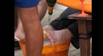 Assista ao vídeo de garçom lavando os pés de milionário com champanhe Veuve Clicquot