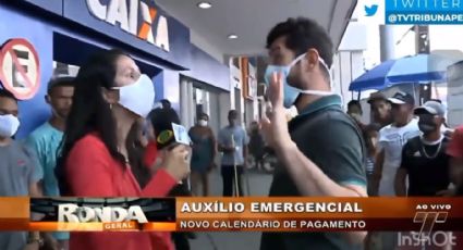 Guardião da Caixa: Homem tenta interromper entrevista sobre auxílio emergencial e leva invertida de repórter da Band