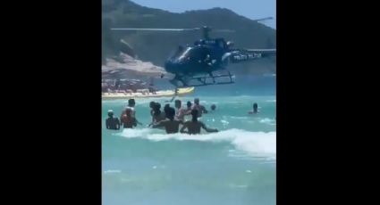 VÍDEO: PM deixa fuzil cair de helicóptero no mar em Cabo Frio; banhistas resgatam a arma