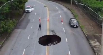 VÍDEO: Chuvas abrem buraco gigante em avenida de BH e assusta moradores